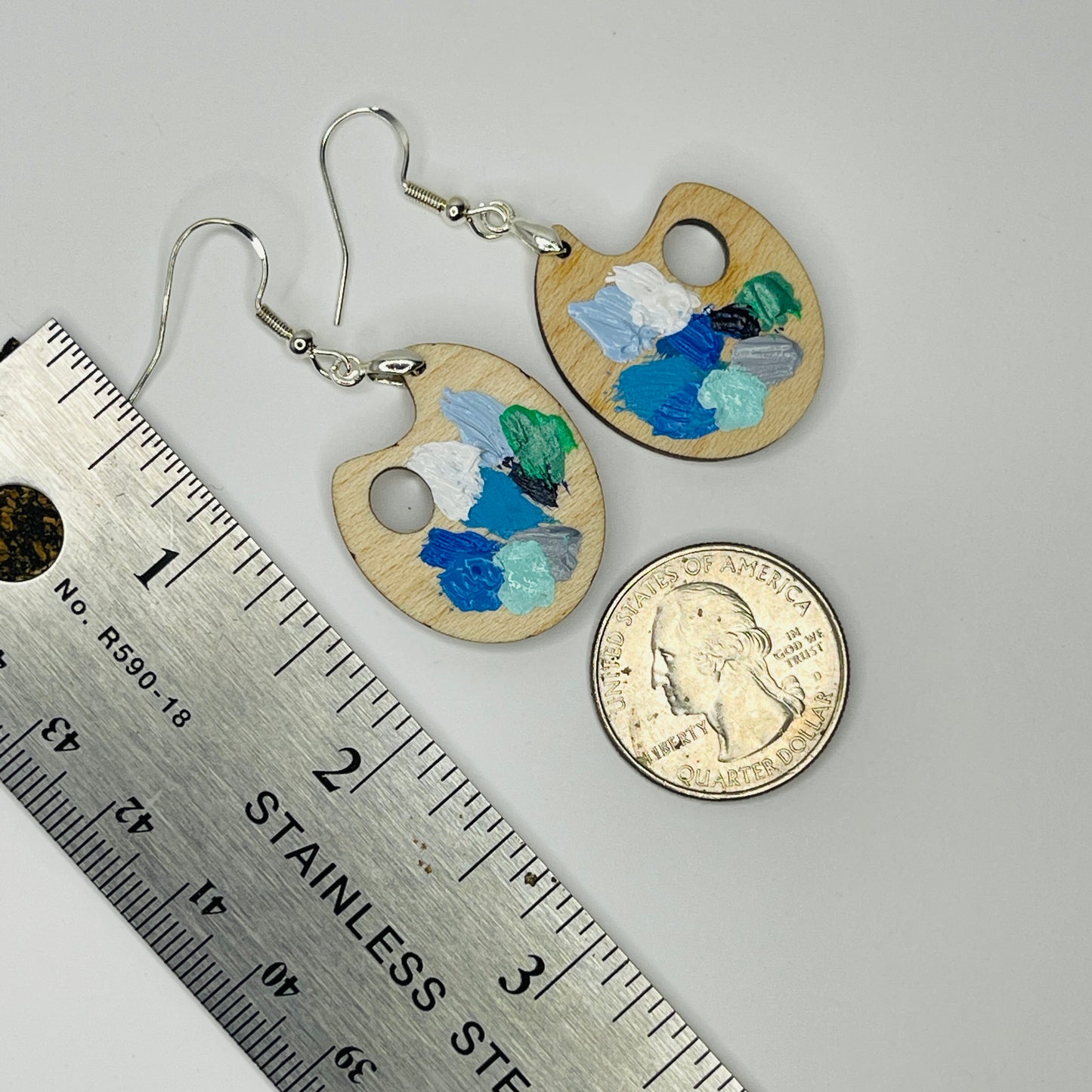 Painter Palette Earrings WINTER Colors. Solid maple Next to a ruler and coin for size comparison.