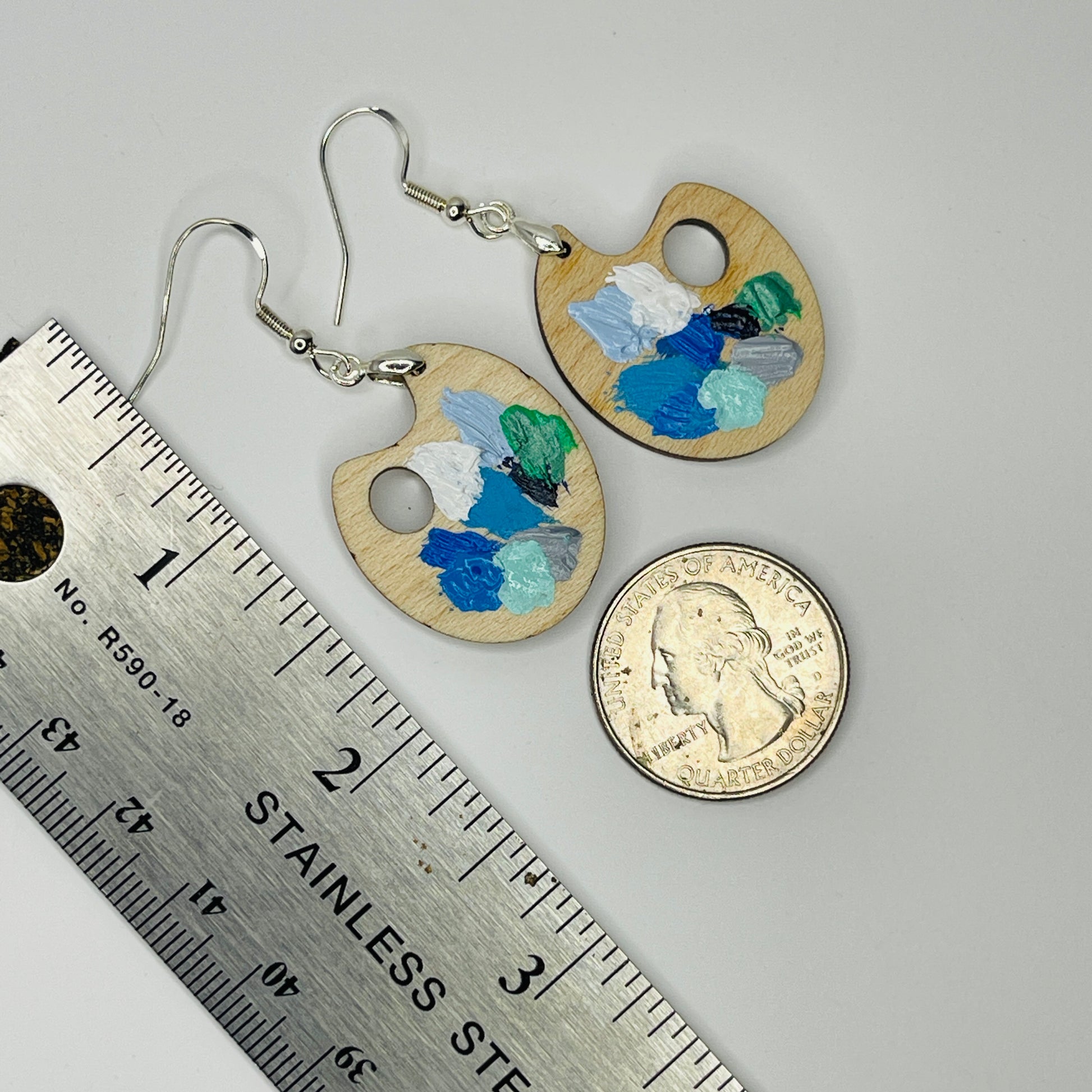 Painter Palette Earrings WINTER Colors. Solid maple Next to a ruler and coin for size comparison.