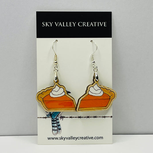 Lser Cut and hand-painted maple pumpkin pie earrings on a 'Sky Valley Creative' branded card.