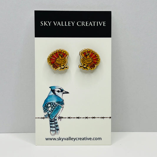 Pair of post earrings with a turkey design on a card with 'Sky Valley Creative' branding.